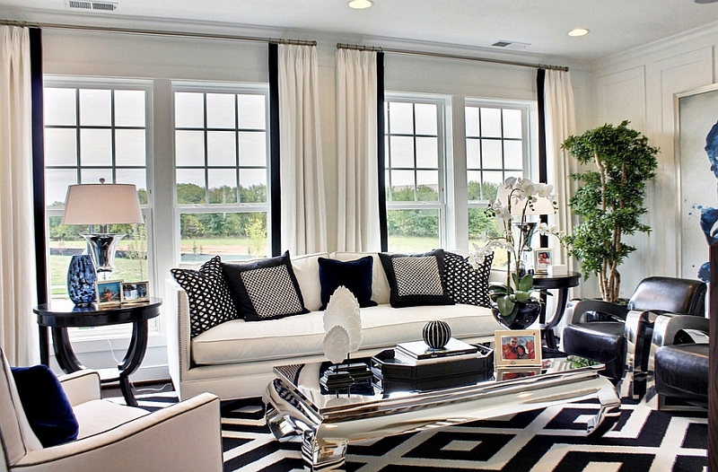Bold-pattern-of-the-rug-and-the-throw-pillows-drive-home-the-black-and-white-color-palette.jpg